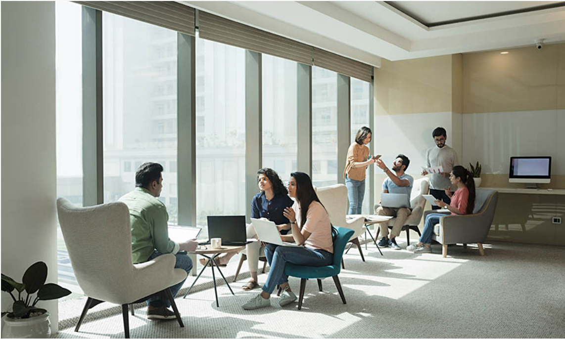 Team collaborating in a modern office lounge